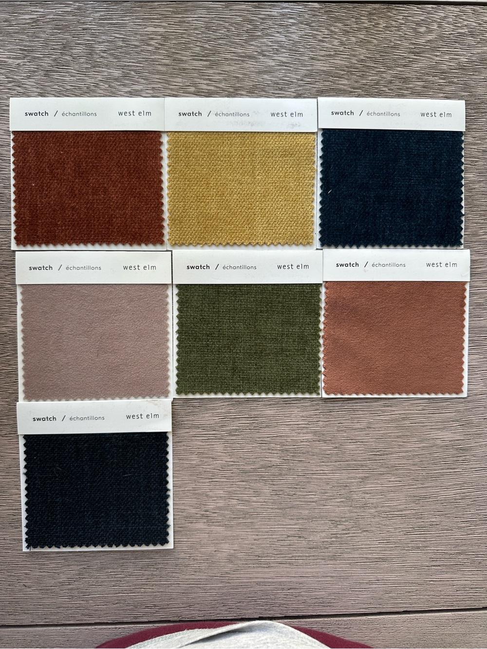 West Elm fabric swatch set — mustard, olive, navy, blush, rust, burnt orange